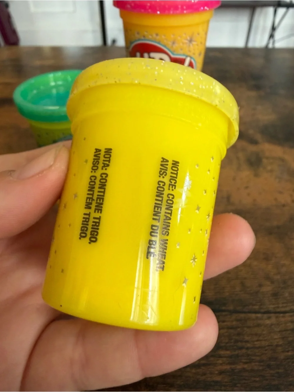Play-Doh small Yellow with Pink, Teal, Purple, and Green Lids comes with all